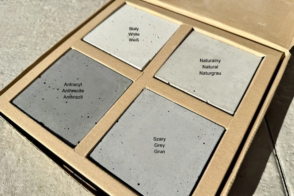 Paleta kolorów produktów Betonova z betonu architektonicznego – cztery podstawowe odcienie: biały, naturalny, szary i antracyt. Przykład wykończenia powierzchni i struktury betonu architektonicznego Betonova, idealny do nowoczesnych wnętrz, elewacji i elementów małej architektury.